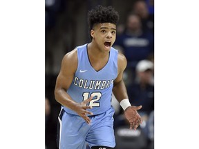 Columbia's Mike Smith reacts after making a basket in the first half of an NCAA college basketball game against Connecticut, Wednesday, Nov. 29, 2017, in Storrs, Conn. (AP Photo/Jessica Hill)