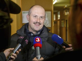 Banska Bystrica governor and far-right political leader Marian Kotleba speaks to journalists after casting his vote during the Slovak regional elections in Banska Bystrica, Central Slovakia, Saturday Nov. 4, 2017. The fight for new Banska Bystrica governor, in which far-right political leader Marian Kotleba is defending the post against businessman Jan Lunter, will be the most closely followed duel of the Slovak regional elections to be held on Saturday. (Jan Miskovsky/CTK via AP)