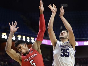Northwestern's Aaron Falzon (35) is fouled by Texas Tech guard Justin Gray (5) in the first half of an NCAA college basketball game Sunday, Nov. 19, 2017, at the Mohegan Sun Arena in Uncasville, Conn. (AP Photo/Stephen Dunn)