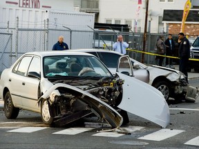 Waterbury police investigate a car crash on South Main Street at East Liberty Street in Waterbury, Conn., Tuesday, Nov. 21, 2017. Authorities say a teenage driver fleeing police in Connecticut has crashed his car at an intersection, killing a 3-year-old and injuring three other people on the sidewalk. (Jim Shannon/Republican-American via AP)