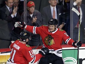Chicago Blackhawks center Artem Anisimov, right, celebrates with defenseman Cody Franson after scoring his goal against the Philadelphia Flyers during the second period of an NHL hockey game Wednesday, Nov. 1, 2017, in Chicago. (AP Photo/Nam Y. Huh)