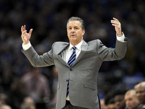 Kentucky coach John Calipari motions to his team during the first half of an NCAA college basketball game against Kansas on Tuesday, Nov. 14, 2017, in Chicago. (AP Photo/Paul Beaty)