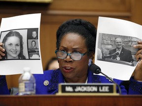 Rep. Sheila Jackson Lee, D-Texas, holds up pictures of women, left, who are accusing Alabama Republican Senate candidate Roy Moore, shown right, as she questions Attorney General Jeff Sessions during a House Judiciary Committee hearing on Capitol Hill, Tuesday, Nov. 14, 2017 in Washington. (AP Photo/Alex Brandon)