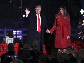 President Donald Trump and first lady Melania Trump arrive at the lighting ceremony for the 2017 National Christmas Tree on the Ellipse near the White House, Thursday, Nov. 30, 2017, in Washington. (AP Photo/Andrew Harnik)
