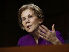 Senate Banking, Housing, and Urban Affairs Committee member Sen. Elizabeth Warren, D-Mass., questions Jerome Powell, President Donald Trump's nominee for chairman of the Federal Reserve, during a Senate Banking, Housing, and Urban Affairs Committee hearing on Capitol Hill in Washington, Tuesday, Nov. 28, 2017. (AP Photo/Carolyn Kaster)