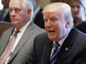 Secretary of State Rex Tillerson listens as President Donald Trump announces that the United States will designate North Korea a state sponsor of terrorism during a cabinet meeting at the White House, Monday, Nov. 20, 2017, in Washington. (AP Photo/Evan Vucci)