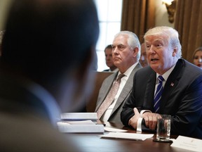 Secretary of State Rex Tillerson listens as President Donald Trump announces that the United States will designate North Korea a state sponsor of terrorism during a cabinet meeting at the White House, Monday, Nov. 20, 2017, in Washington. (AP Photo/Evan Vucci)