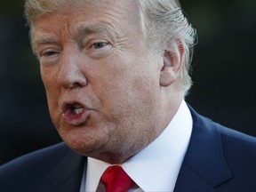 President Donald Trump speaks with reporters before departing the White House for a trip to Asia, Friday, Nov. 3, 2017, in Washington. (AP Photo/Evan Vucci)