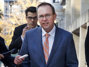 Mick Mulvaney returns to the Consumer Financial Protection Bureau in Washington, Monday afternoon, Nov. 27, 2017. (AP Photo/Jacquelyn Martin)