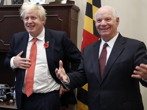Britain's Foreign Secretary Boris Johnson, left, and Sen. Ben Cardin, D-Md., right, meet at Cardin's office where they are expected to speak about the Iran nuclear deal, Wednesday, Nov. 8, 2017, on Capitol Hill in Washington. (AP Photo/Jacquelyn Martin)