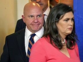 White House press secretary Sarah Huckabee Sanders, right, arrives with National Security Adviser H.R. McMaster, left, for the daily briefing in the Brady Press Briefing Room of the White House, Thursday, Nov. 2, 2017. (AP Photo/Pablo Martinez Monsivais)