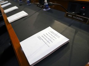Copies of the Finance Committee Markup are placed for each member of the Senate Finance Committee before the start of the hearing as the tax-writing panel begins work on overhauling the nation's tax code, on Capitol Hill in Washington, Monday, Nov. 13, 2017. The legislation in the House and Senate carries high political stakes for President Donald Trump and Republican leaders in Congress, who view passage of tax cuts as critical to the GOP's success at the polls next year. (AP Photo/Pablo Martinez Monsivais)