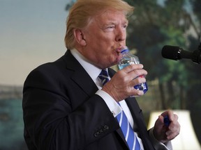 President Donald Trump pauses to drink water as he speaks in the Diplomatic Reception Room of the White House, Wednesday, Nov. 15, 2017 in Washington. (AP Photo/Pablo Martinez Monsivais)