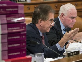Rep. Jim Renacci, R-Ohio, joined at right by Rep. Pat Meehan, R-Pa., makes a point as the House Ways and Means Committee continues its debate over the Republican tax reform package, on Capitol Hill in Washington, Wednesday, Nov. 8, 2017. (AP Photo/J. Scott Applewhite)