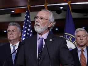 Rep. Dan Newhouse, R-Wash., center, flanked by Rep. Peter King, R-N.Y., left, and Rep. Fred Upton, R-Mich., join a group of Republican lawmakers to encourage support for the Deferred Action for Childhood Arrivals (DACA) program​, during a news conference on Capitol Hill in Washington, Thursday, Nov. 9, 2017. (AP Photo/J. Scott Applewhite)