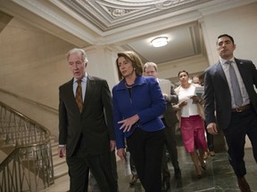 Rep. Richard Neal, D-Mass., left, the ranking member of the House Ways and Means Committee, and House Minority Leader Nancy Pelosi, D-Calif., confer on their way to speak to reporters about the GOP tax bill as debate enters a final day, on Capitol Hill in Washington, Thursday, Nov. 9, 2017. (AP Photo/J. Scott Applewhite)