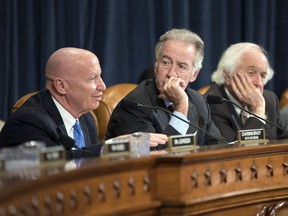 House Ways and Means Committee Chairman Kevin Brady, R-Texas, left, joined by Rep. Richard Neal, D-Mass., the ranking member, and Rep. Sander Levin, D-Mich., offers his manager's amendment as the GOP tax bill debate enters the final stage, on Capitol Hill in Washington, Thursday, Nov. 9, 2017. (AP Photo/J. Scott Applewhite)