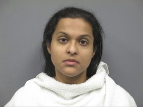 This photo provided by the Richardson, Texas, Police Department, shows Sini Ann Mathews, who was arrested Thursday, Nov. 16, 2017, after surrendering to police. Mathews, the mother of Sherin Mathews, a 3-year-old who was adopted from India whose body was recovered last month from a drainage culvert weeks after she was reported missing, was charged with child abandonment after police allege that she left her home alone. (Richardson Police Department via AP)