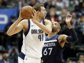 Dallas Mavericks forward Dirk Nowitzki (41), of Germany, looks for an opening to the basket against Minnesota Timberwolves' Taj Gibson (67) in the first half of an NBA basketball game, Friday, Nov. 17, 2017, in Dallas. (AP Photo/Tony Gutierrez)