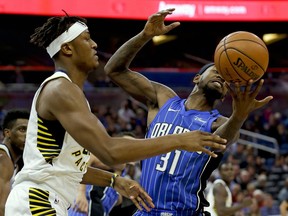 Indiana Pacers' Myles Turner, left, and Orlando Magic's Terrence Ross (31) go after a rebound during the first half of an NBA basketball game, Monday, Nov. 20, 2017, in Orlando, Fla. (AP Photo/John Raoux)