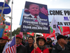 Pro-Trump supporters wait for Donald Trump outside the National Cemetery in Seoul on Nov. 8, 2017.
