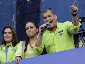 Former Ecuadorean President Rafael Correa speaks to supporters a few days after returning to his native country, from his political party's headquarters in Quito, Ecuador, Tuesday, Nov. 28, 2017. Correa lives in Belgium where his wife is from, and has repeatedly said that he would only come out of political retirement if the social gains of what he calls his Citizens' Revolution were threatened. (AP Photo/Dolores Ochoa)