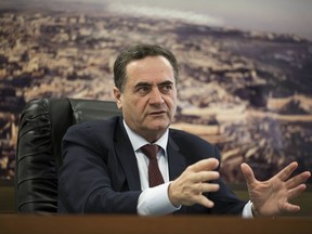 In this March 7, 2017 file photo, Israel's transportation and intelligence minister Yisrael Katz speaks during an interview with The Associated Press, in his office in Tel Aviv, Israel.  Katz told The AP on Thursday, Nov. 9, 2017, that following the surprising resignation of Lebanon's prime minister, Israel is planning a diplomatic offensive against Iran and its Lebanese proxy Hezbollah at the United Nations. (AP Photo/Dan Balilty, File)