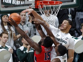 Michigan State's Gavin Schilling, right, blocks a shot by Stony Brook's Akwasi Yeboah (15) during the first half of an NCAA college basketball game, Sunday, Nov. 19, 2017, in East Lansing, Mich. (AP Photo/Al Goldis)