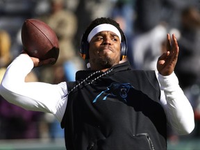 Carolina Panthers quarterback Cam Newton works out prior to an NFL football game against the New York Jets, Sunday, Nov. 26, 2017, in East Rutherford, N.J. (AP Photo/Kathy Willens)