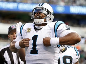 Carolina Panthers quarterback Cam Newton (1) celebrates after scoring on a touchdown run against the New York Jets during the first half of an NFL football game, Sunday, Nov. 26, 2017, in East Rutherford, N.J. (AP Photo/Kathy Willens)