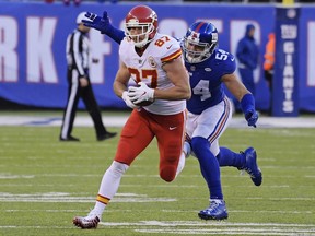 New York Giants' Olivier Vernon (54) tackles Kansas City Chiefs' Travis Kelce (87) during the second half of an NFL football game Sunday, Nov. 19, 2017, in East Rutherford, N.J. (AP Photo/Bill Kostroun)