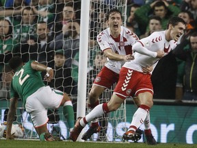 Denmark's Thomas Delaney, left, and Denmark's Andreas Christensen celebrate after scoring during the World Cup qualifying play off second leg soccer match between Ireland and Denmark at the Aviva Stadium in Dublin, Ireland, Tuesday, Nov. 14, 2017. (AP Photo/Peter Morrison)