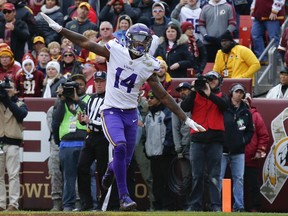 Minnesota Vikings wide receiver Stefon Diggs (14) celebrates his touchdown during the first half of an NFL football game against the Washington Redskins in Landover, Md., Sunday, Nov. 12, 2017. (AP Photo/Alex Brandon)