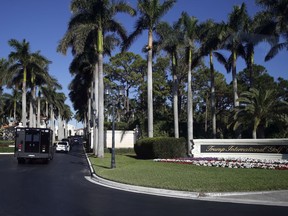 The motorcade of President Donald Trump arrives at at the Trump International Golf Club, Wednesday, Nov. 22, 2017, in West Palm Beach, Fla. (AP Photo/Alex Brandon)