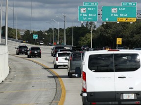 The motorcade for President Donald Trump is seen, Friday, Nov. 24, 2017, in Palm Beach Gardens, Fla. Trump is en route to his Trump National Golf Club, in Jupiter, Fla. (AP Photo/Alex Brandon)