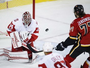 Mark Jankowski of the Calgary Flames has the puck bounce off him and past Detroit Red Wings' goalie Petr Mrazek during NHL action Thursday night in Calgary. Jankowski scored his first career NHL goal as the Flames posted a 6-3 victory.