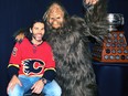 In this Oct. 28, 2017 file photo, Calgary Flames winger Jaromir Jagr (left) meets a person dressed as Bigfoot at the team's Ultimate Fan Weekend.