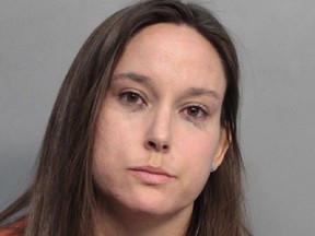 Bridget Freitas is seen in an undated photo provided by the Miami-Dade Police Department. Police have charged Freitas, a 30-year-old nurse, with felony battery on a police officer for her part in a videotaped altercation with a detective at a University of Miami football game. Police said Bridget Freitas slapped an officer while being carried out during Miami's win Saturday, Nov. 4, 2017, over Virginia Tech at Hard Rock Stadium.  (Miami-Dade Police Department via AP)