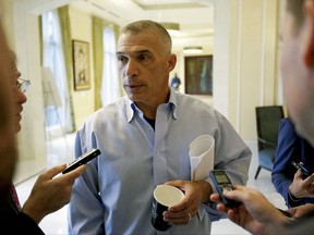 Former New York Yankees manager Joe Girardi talks with reporters at the annual MLB  general managers' meetings, Tuesday, Nov. 14, 2017, in Orlando, Fla. (AP Photo/John Raoux)