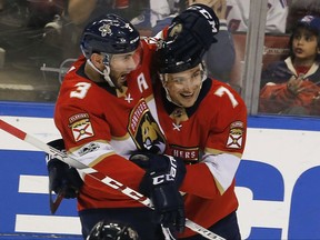 Florida Panthers center Colton Sceviour (7) celebrates his second period goal against the New York Rangers with teammate Keith Yandle (3) in an NHL hockey game, Saturday, Nov. 4, 2017, in Sunrise, Fla. (AP Photo/Joe Skipper)