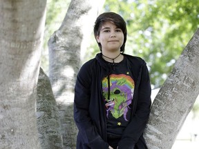 FILE - In this Thursday, May 14, 2015 file photo, Alex Ramos, 13, who now goes by the name Theo Ramos, poses for a photograph in a park near his home in Homestead, Fla. "When you're 10 years old, you really shouldn't be worried about who you are," Theo would say years later, in a moment of reflection. "You shouldn't be having that existential question when you're in fifth grade. You should be worried about homework and the fifth-grade dance coming up." (AP Photo/Lynne Sladky)