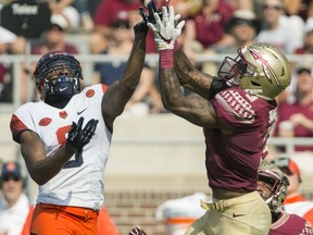 Florida State defensive back Derwin James, right, breaks up a Syracuse pass intended for Steve Ishmael in the first half of an NCAA college football game in Tallahassee, Fla., Saturday, Nov. 4, 2017. (AP Photo/Mark Wallheiser)