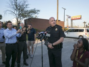 Tampa Police Chief Brian Dugan holds a news conference in a parking lot behind the Ybor City McDonalds on Tuesday, Nov. 28, 2017, in Tampa, Fla. Police were questioning an employee at the McDonald's in Ybor City about a gun he brought to the restaurant. Dugan said this development could be connected to the investigation into the Seminole Heights murders. (Gabriella Angotti-Jones/Tampa Bay Times via AP)