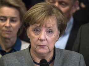 German Chancellor Angela Merkel gives a statement after the pre-talks on forming a new German government failed early Monday, Nov. 20, 2017 in Berlin. (Bernd von Jutrczenka/dpa via AP)