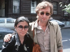 FILE - In this Aug. 22, 1980, file photo, John Lennon, right, and his wife, Yoko Ono, arrive at The Hit Factory, a recording studio in New York City. German police said Monday, Nov. 20, 2017 they have arrested a man suspected of handling stolen objects from the estate of John Lennon, including diaries which were stolen from Lennon's widow, Yoko Ono, in New York in 2006.  (AP Photo/Steve Sands, File)