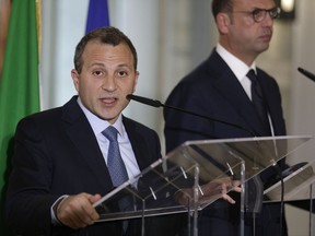 Lebanese Foreign Minister Gebran Bassil, left, and Italian Foreign Minister Angelino Alfano attend a joint press conference at the Farnesina palace, in Rome, Wednesday, Nov. 15, 2017. (AP Photo/Andrew Medichini)