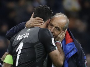 FILE - In this Monday, Nov. 13, 2017 file photo, Italy goalkeeper Gianluigi Buffon is comforted by Italy coach Gian Piero Ventura, right, at the end of the World Cup qualifying play-off second leg soccer match between Italy and Sweden, at the Milan San Siro stadium, Italy.  Italy coach Gian Piero Ventura has been fired Wednesday, Nov. 15, 2017 following the Azzurri's failure to qualify for the World Cup. Ventura leaves in disgrace, widely criticized for his tactical decisions that left Italy out of football's biggest competition for the first time in six decades. A football federation statement says Ventura is "no longer coach of the national team." (AP Photo/Luca Bruno, File)