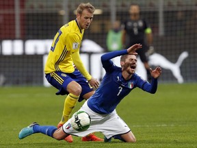 Italy's Jorginho, right, is fouled by Sweden's Ola Toivonen during the World Cup qualifying play-off second leg soccer match between Italy and Sweden, at the Milan San Siro stadium, Italy, Monday, Nov. 13, 2017. (AP Photo/Antonio Calanni)
