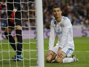 Real Madrid's Cristiano Ronaldo looks up after missing a chance during the Spanish La Liga soccer match between Real Madrid and Malaga at the Santiago Bernabeu stadium in Madrid, Saturday, Nov. 25, 2017. (AP Photo/Francisco Seco)