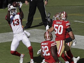 Arizona Cardinals wide receiver Jaron Brown (13) catches a touchdown pass against the San Francisco 49ers during the first half of an NFL football game in Santa Clara, Calif., Sunday, Nov. 5, 2017. (AP Photo/Marcio Jose Sanchez)